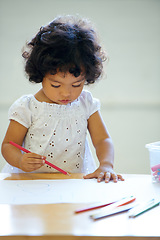 Image showing Young girl, drawing and classroom for creative development, education growth in kindergarten. Child, daycare and table pencils artwork for learning play in school or paper crayons, kid craft or color