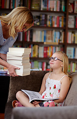 Image showing Reading, books and woman with crying child in library, learning and studying on couch for knowledge. Storytelling, mother and girl in bookstore together with story, fantasy and education on sofa.