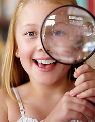 Image showing Happy, portrait and a child with a magnifying glass in a library for education, learning or inspection. Smile, young detective and a girl, kid or student with equipment for studying or attention