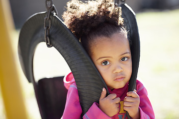 Image showing African kid, swing and portrait outdoor at school, park or kindergarten with playful games in spring. Child, nature and development with freedom, adventure and learning in nature, summer and sunshine