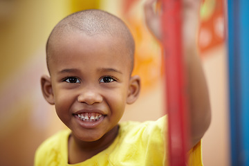 Image showing African boy, portrait and smile in classroom at kindergarten with pride for development, scholarship or learning. Child, student and face at school, happy and education for future, growth or academy