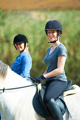 Image showing Women, horse riding outdoor and smile in portrait with helmet, ranger team or equestrian exercise. Girl friends, jockey and happy with adventure, training and learning for competition in countryside