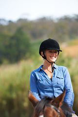 Image showing Woman, horse riding outdoor and happy in portrait with helmet, ranger or exercise with equine pet. Girl, jockey and animal with smile on adventure, training or learning for competition in countryside