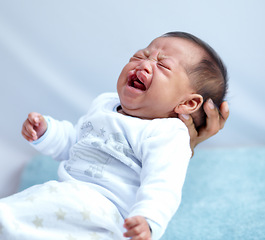 Image showing Newborn, crying and cleft palate with parent, mom and home with tears, sick and frustrated. Medical child, syndrome and house bedroom for healthcare, childcare and mouth for baby, pain and sadness