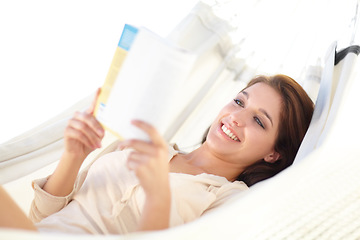 Image showing Happy woman, relax and reading book on hammock for holiday, weekend or break in leisure at home. Female person, lying and smile with novel in comfort for knowledge, literature or story at house