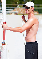 Image showing Man tie net at beach, volleyball and preparation or competition set up, game or match in summer. Sports, sand and athlete getting ready for training, exercise and workout, fitness and smile outdoor