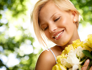 Image showing Smile, nature and woman in garden with flower bouquet for holiday in spring on outdoor picnic. Roses, freedom and happiness, girl in park for weekend in floral countryside with sunshine on vacation.