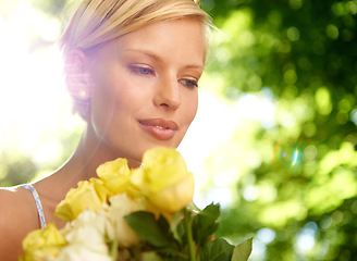 Image showing Sunshine, thinking and woman in garden with flowers for holiday in spring on outdoor picnic. Smile, freedom and face of girl in park with happiness, rose bouquet and vacation in countryside to relax.