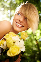 Image showing Happiness, nature and woman in garden with flowers for holiday in spring, outdoor fun and adventure. Smile, freedom and girl in park with roses in bouquet in countryside with sunshine on vacation.