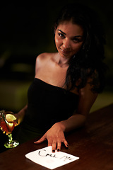 Image showing Woman, call me and flirt with lipstick on napkin, seduce and sexy or message for bartender. Brazilian female person, alcohol and drunk or tipsy, outdoors and smiling at night, event and party