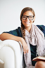 Image showing Portrait, smile and woman in glasses on sofa for fashion in living room of home or apartment. Face, eyewear and confident girl in lounge relax on couch in style, cool clothes or scarf in Switzerland