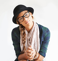 Image showing Portrait, hat and woman in glasses for fashion in studio isolated on white background. Face, eyewear and confident girl, serious model and young person in style, cool clothes and scarf in Switzerland