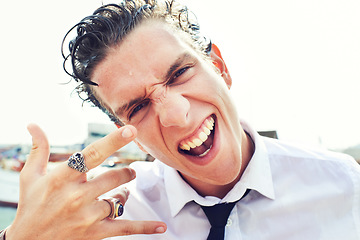 Image showing Horns, punk and man with portrait, excited and celebration with edgy style, fashion and character. Face, person and guy with emo, jewelry and cyberpunk with hobby, hand gesture and Halloween costume