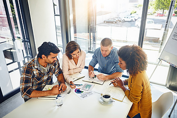 Image showing Team, review and meeting with graphs and stats of company target, goals or market research with data analysis. Above, table or paperwork report of growth, progress or startup performance analytics