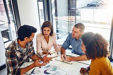 Image showing Stats, meeting and paperwork data analysis in office with report of market research for kpi, target and goals. Analytics, graphs and above people at desk in workplace with marketing strategy