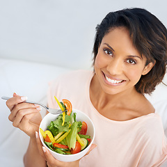 Image showing Lunch, salad and portrait of happy woman eating for nutrition, health and wellness in diet. Healthy food, fruit and vegetables in bowl for meal on sofa in home living room with happiness and a smile