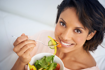 Image showing Eating, salad and portrait of happy woman with lunch, nutrition and wellness in diet. Healthy food, fruit and vegetables in bowl for meal on sofa in home living room with happiness and a smile