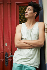 Image showing Thinking, arms crossed and serious man at door of home, outdoor and contemplating. Vision, planning and confident person at doorway or entrance of house with idea for fashion, style or trendy clothes