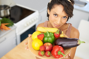 Image showing Portrait, health and vegetables with a woman in the kitchen of her home for nutrition, diet or meal preparation. Face, ingredients and a recipe for cooking food with a young person in her apartment