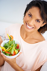 Image showing Eating, salad and portrait of happy woman with nutrition, health and wellness in diet. Healthy food, fruit and vegetables in bowl for lunch on sofa in home living room with happiness and a smile