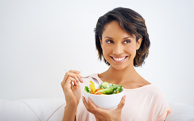 Image showing Happy, health and young woman with a salad at home with vegetables for wellness, organic or diet. Smile, nutrition and female person from Mexico eating healthy meal with produce in living room.