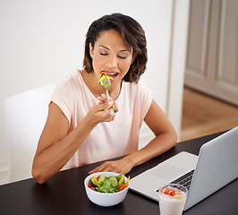 Image showing Eating, salad and woman with laptop, remote work and healthy food or nutrition in home office. Hungry, person and working on lunch break with fruit and vegetables for energy or wellness in house