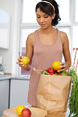 Image showing Kitchen, vegetables and woman with groceries, consumer and wellness with retail, package and customer. Person, client and girl with nutrition, home and meal with brown bag, thinking and healthy food