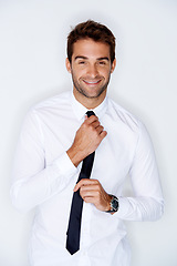 Image showing Portrait, smile for fashion with a man in a shirt and tie in studio on a gray background for chic style. Business, getting ready or dressing with a happy young model in trendy clothes for work