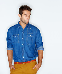 Image showing Thinking, stylish and a man with clothes for fashion, trendy and denim on a white background. Young, cool and a person or model with an idea, shirt or hipster clothing on a backdrop for style