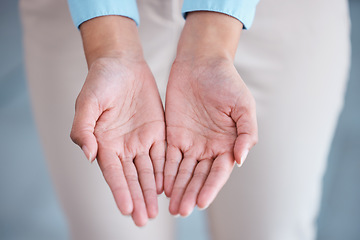 Image showing Above view and closeup of two hands extended with open palms in a giving and receiving gesture. Unknown mixed race businesswoman asking for help. Hispanic office professional offering support