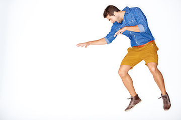 Image showing Jump, fight and a man on a white background for attack, aggressive or angry with mockup space. Anger, studio and a frustrated, crazy or screaming guy or person with mental health on a backdrop