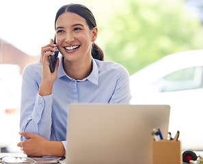 Image showing Making those big deals happen right away. a young businesswoman talking on a cellphone while working in an office.