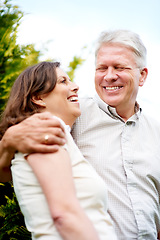 Image showing Senior couple, happy and laughing with hug, marriage and embrace in outdoor, retired or smile. Retirement, elderly or love with face, bonding together or joke for romantic relationship, man or woman