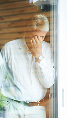 Image showing Mature man at window, thinking and stress in home with doubt, anxiety for decision and lonely memory. Sad, worry and worried senior person with insight, reflection and ideas for retirement in bedroom