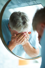 Image showing Water splash, mirror or senior man cleaning for skincare or hygiene on blue background in bathroom. Home, reflection or mature person with wellness washing for beauty, grooming or facial treatment