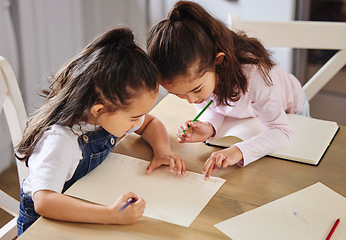 Image showing Two girls playing together. two girls completing their homework together.