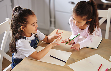 Image showing Sisters are built in best friends. two girls completing their homework together.