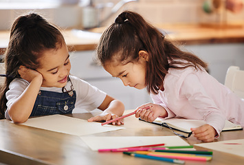 Image showing No one I love more than my sister. two girls completing their homework together.