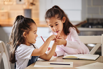 Image showing Use your fingers its easy. two girls completing their homework together.