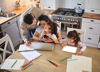 Image showing Stepping in and doing his part. two parents helping their children with homework.