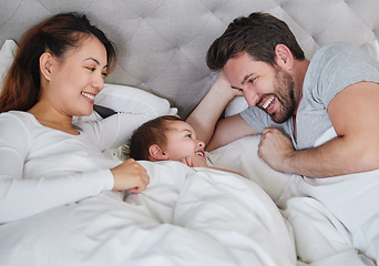 Image showing Nap time for all of us. a young family relaxing at home.