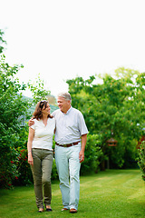 Image showing Mature, holiday or happy couple hug in park or nature on a outdoor romantic walk for support. Wellness, freedom or senior man with woman bonding, care or enjoying date or retirement together outside