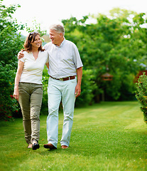 Image showing Mature, garden or happy couple hug in park or nature on a outdoor romantic walk for support. Wellness, freedom or senior man with woman bonding, care or enjoying date or retirement together outside
