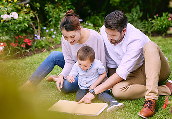 Image showing Family is the most important thing in the world. a family reading a book outside.