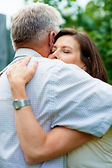 Image showing Senior couple, garden and a hug for commitment, care and bonding together in retirement. Comfort, elderly and a man and woman with affection, romance or loyalty in a marriage in a park for a date