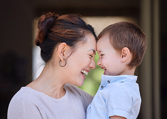 Image showing Making the most of a beautiful day. a mother carrying her son on the porch at home.