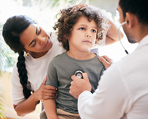 Image showing Please make him better. a little boy being examined by an unrecognizable doctor while his mother holds him.