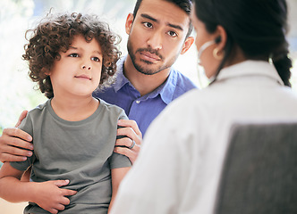 Image showing Professional opinion is needed. a little boy being examined by an unrecognizable doctor while his father holds him.