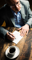 Image showing A solid team together. a mature businessman discussing contracts with a coworker.