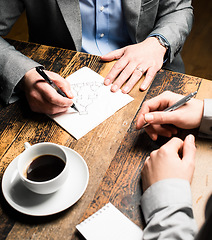 Image showing New year new deal. a mature businessman discussing contracts with a coworker.